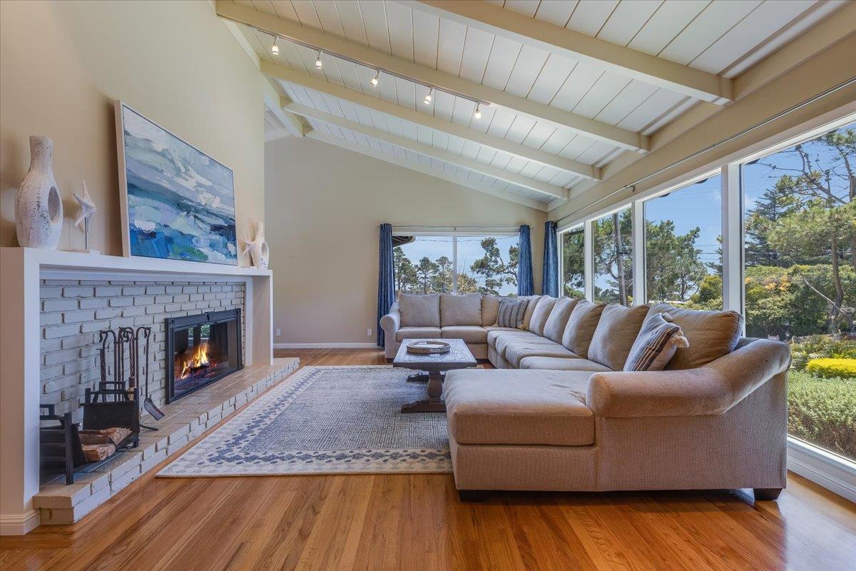 4117 Sunridge Road Pebble Beach, CA 93953 - Photo 6 of 46 a living room with furniture and a fireplace