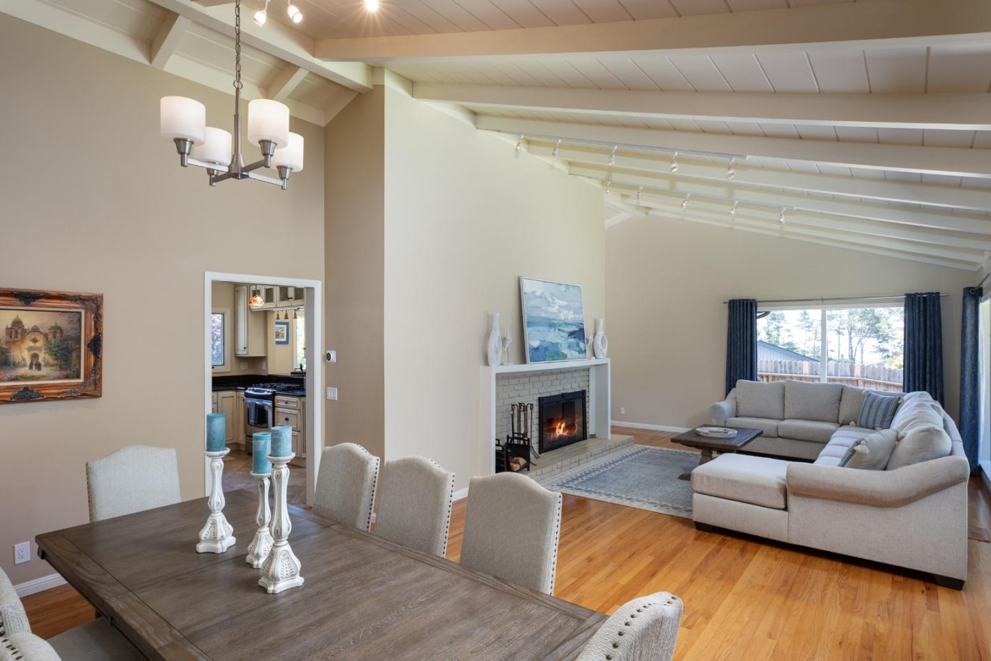 4117 Sunridge Road Pebble Beach, CA 93953 - Photo 7 of 46 a living room with fireplace furniture and a wooden floor