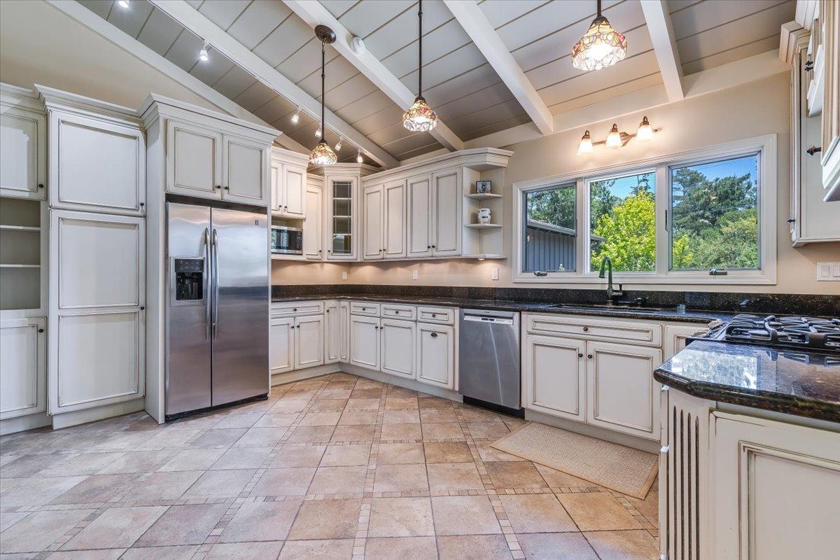 4117 Sunridge Road Pebble Beach, CA 93953 - Photo 10 of 46 a kitchen with stainless steel appliances granite countertop a stove a sink dishwasher a refrigerator and a microwave