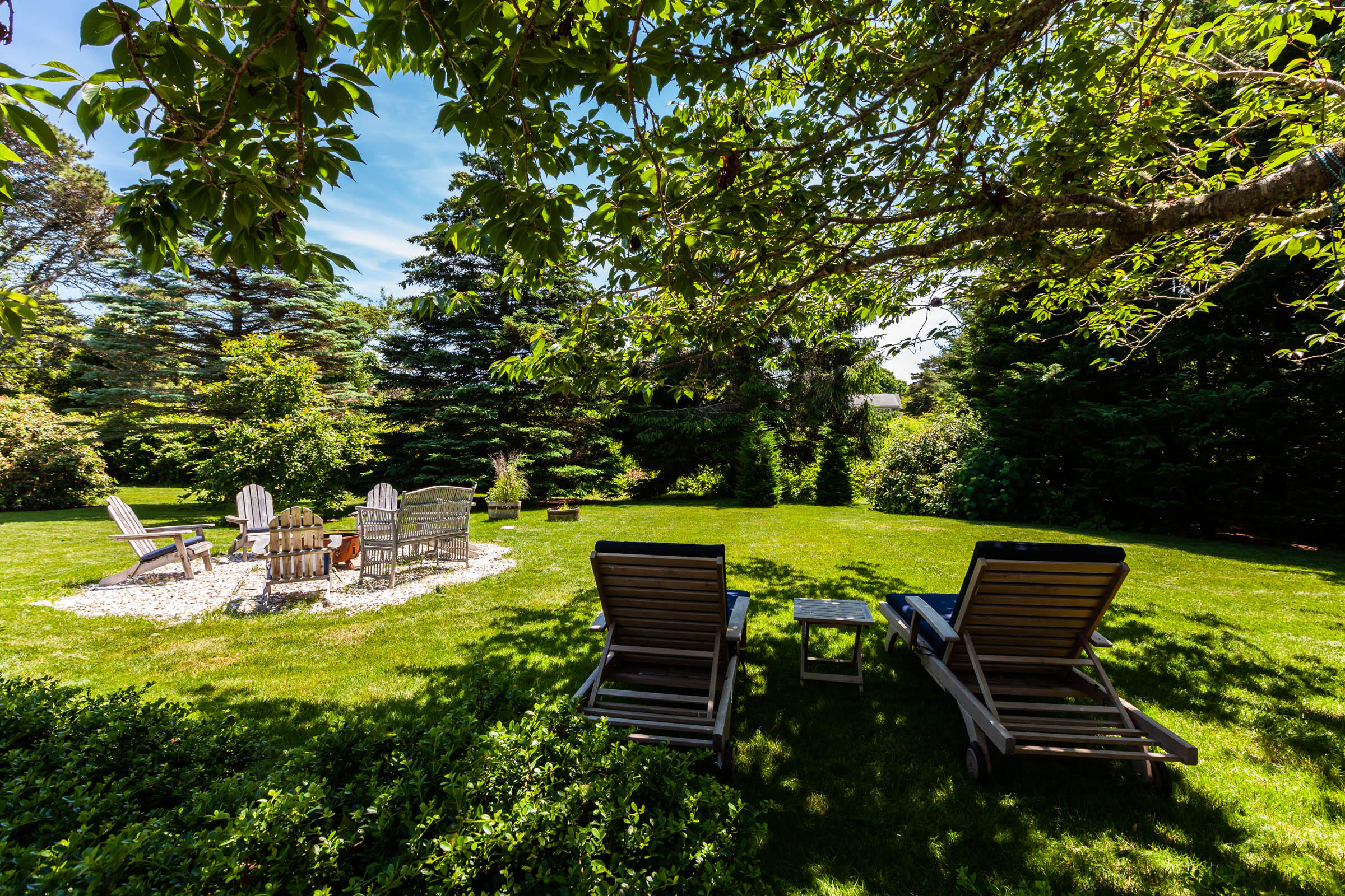 42 Cedar Land Road Orleans, MA 02653 - Photo 13 of 46 a view of a bench in the garden