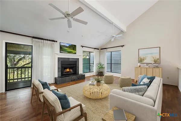 a living room with furniture and a fireplace