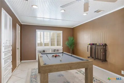 a view of kitchen with furniture and natural light