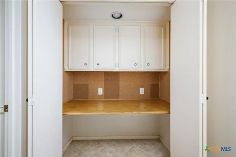 a view of cabinet and tap