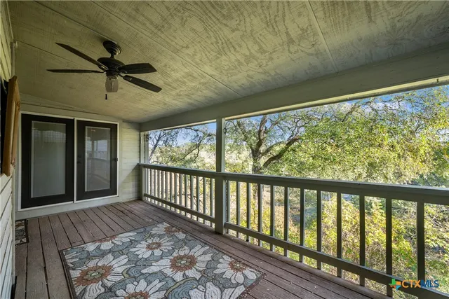 a view of a porch with wooden floor
