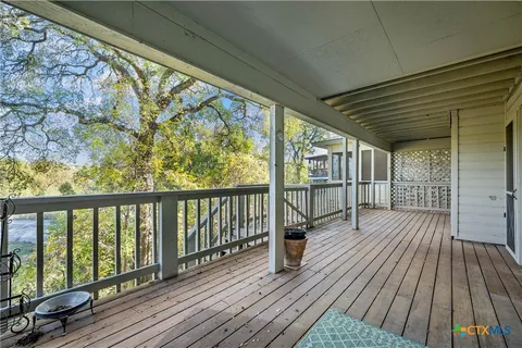 a view of balcony with wooden floor
