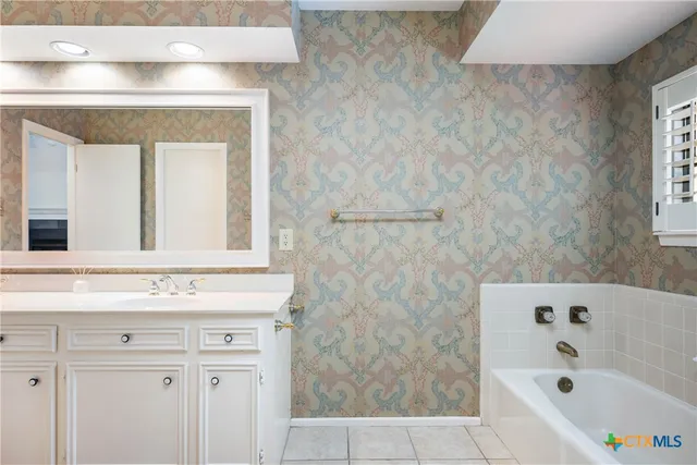 a bathroom with a bathtub and a sink
