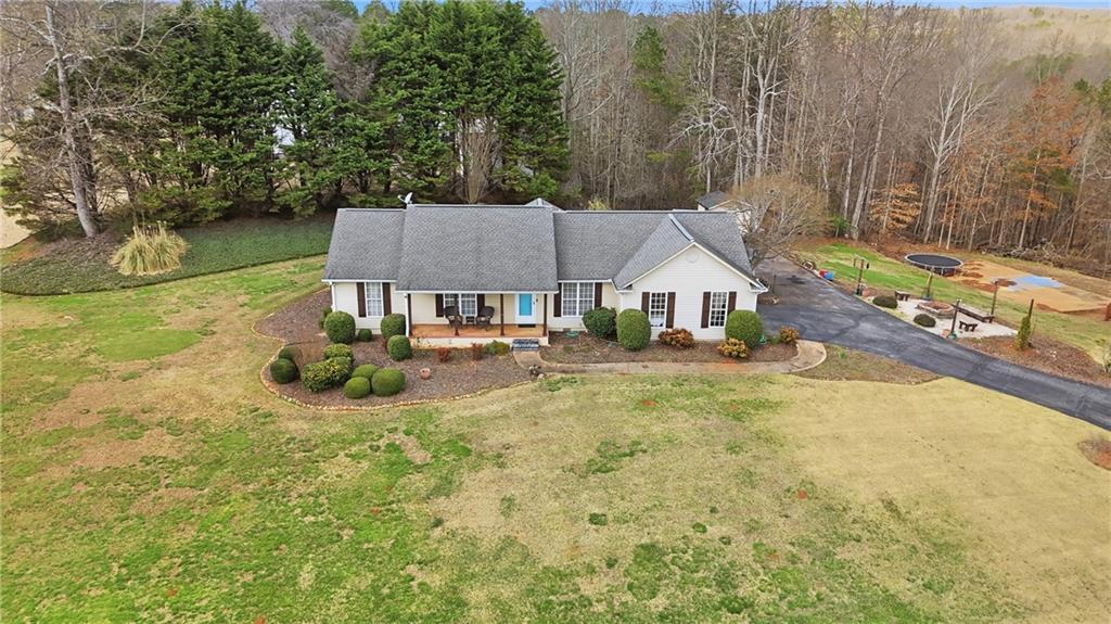 4564 Highway 51 Lula, GA 30554 - Photo 1 of 46 a view of house with backyard and trees