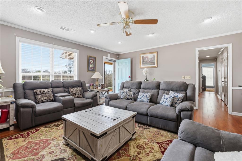 4564 Highway 51 Lula, GA 30554 - Photo 12 of 46 a living room with furniture and a rug