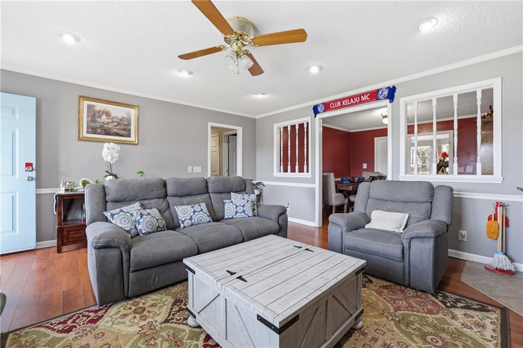 4564 Highway 51 Lula, GA 30554 - Photo 15 of 46 a living room with furniture and a chandelier