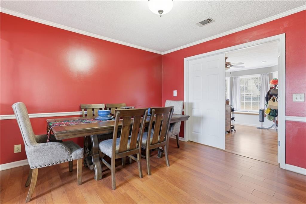4564 Highway 51 Lula, GA 30554 - Photo 16 of 46 a view of a dining room with furniture and wooden floor