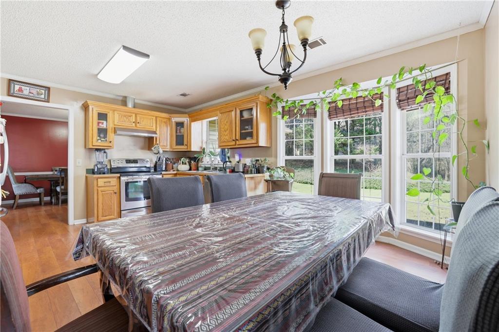 4564 Highway 51 Lula, GA 30554 - Photo 18 of 46 a living room with stainless steel appliances granite countertop furniture and a kitchen view
