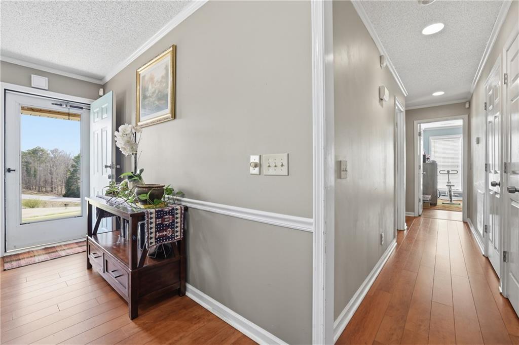 4564 Highway 51 Lula, GA 30554 - Photo 19 of 46 a view of a hallway with wooden floor and staircase