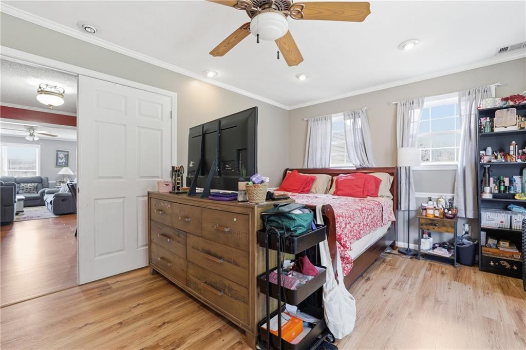 4564 Highway 51 Lula, GA 30554 - Photo 22 of 46 a bed room with a bed and a television