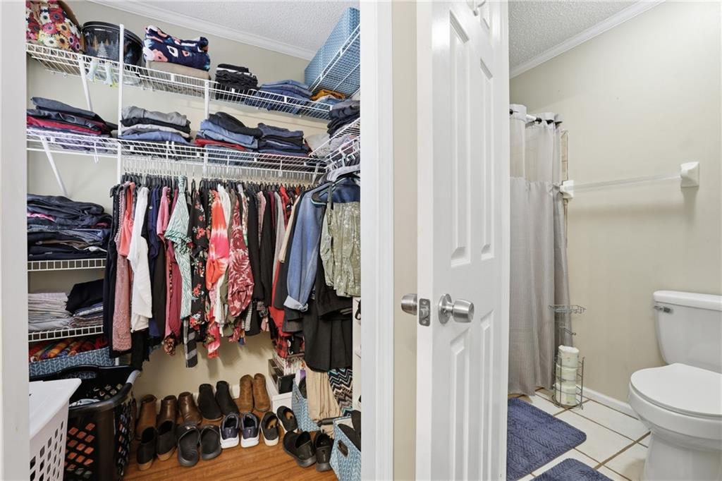4564 Highway 51 Lula, GA 30554 - Photo 23 of 46 a view of walk in closet with clothes and shoes