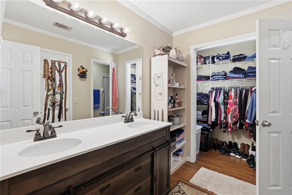 4564 Highway 51 Lula, GA 30554 - Photo 24 of 46 a bathroom with a double vanity sink and a mirror