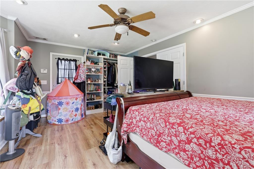 4564 Highway 51 Lula, GA 30554 - Photo 25 of 46 a bedroom with bed and flat screen tv