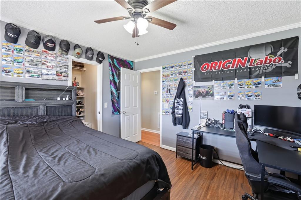 4564 Highway 51 Lula, GA 30554 - Photo 27 of 46 a bedroom with a bed and a desk