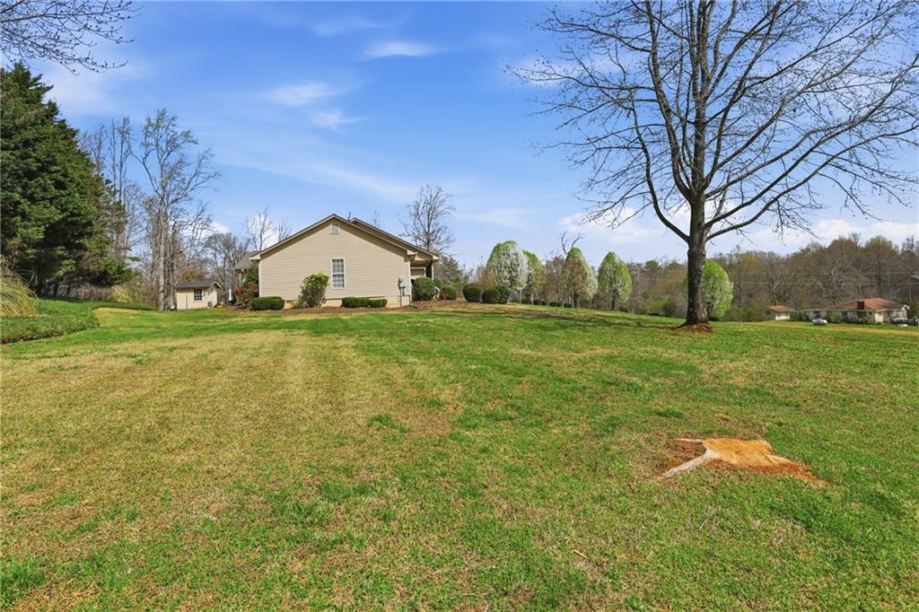 4564 Highway 51 Lula, GA 30554 - Photo 33 of 46 a view of a house with a yard