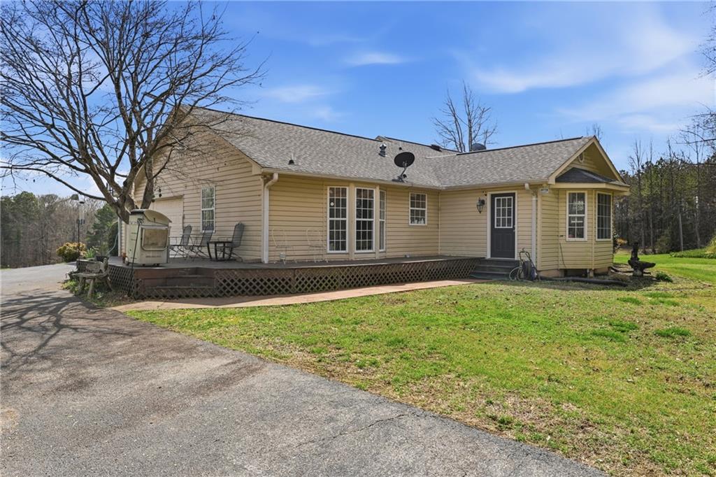 4564 Highway 51 Lula, GA 30554 - Photo 36 of 46 a front view of house with yard and trees around