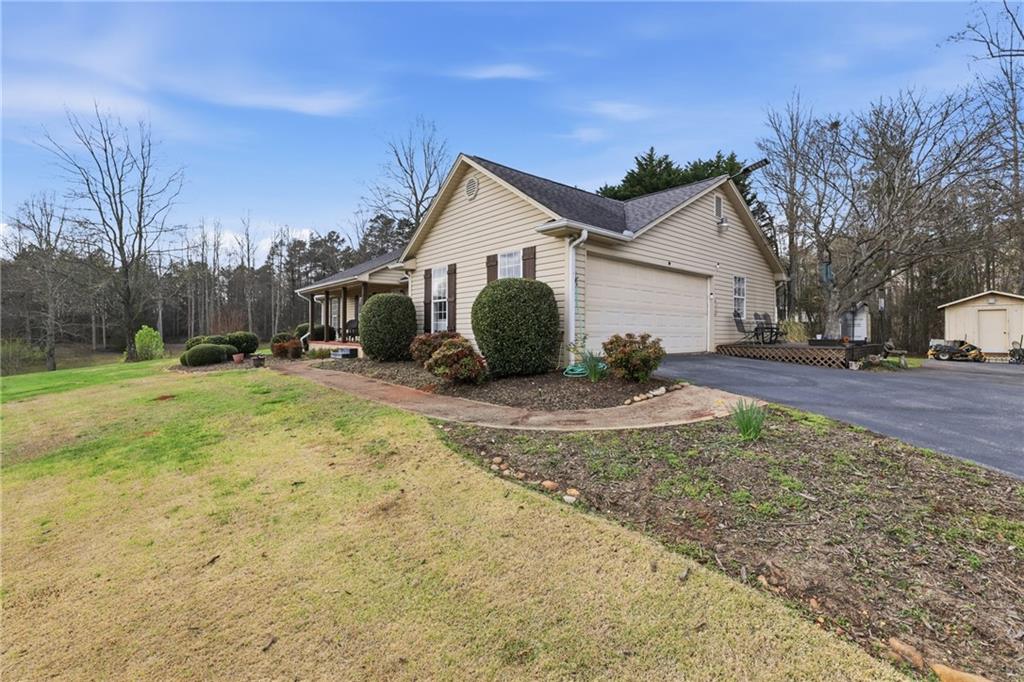 4564 Highway 51 Lula, GA 30554 - Photo 5 of 46 a view of a backyard with a tree