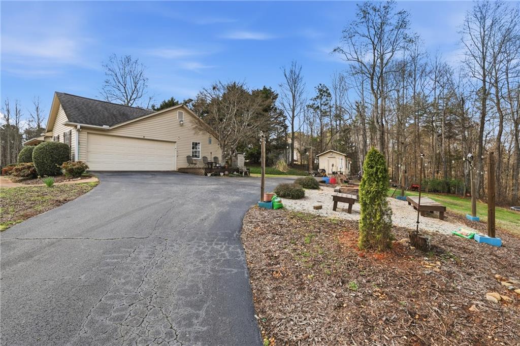 4564 Highway 51 Lula, GA 30554 - Photo 6 of 46 a view of a house with backyard and trees
