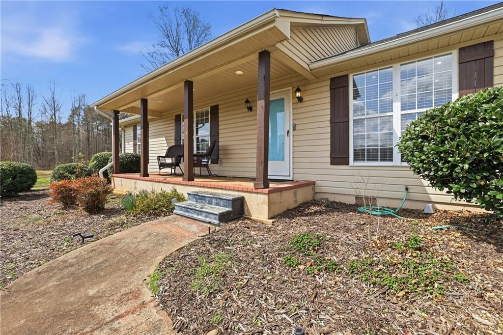 4564 Highway 51 Lula, GA 30554 - Photo 7 of 46 a front view of a house with garden
