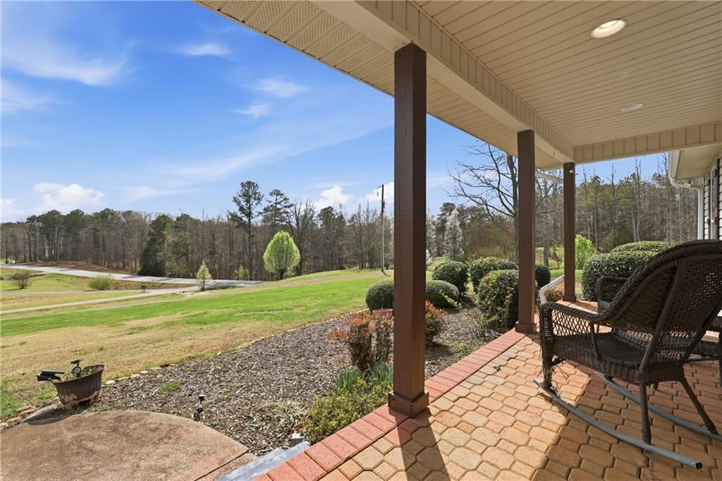 4564 Highway 51 Lula, GA 30554 - Photo 8 of 46 a view of a porch with chairs and backyard