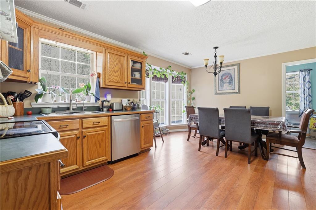 4564 Highway 51 Lula, GA 30554 - Photo 10 of 46 a view of a dining room with furniture window and wooden floor