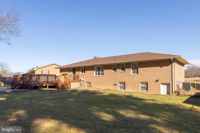 a big house with a big yard and large trees