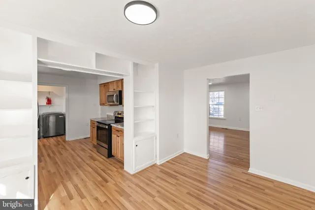 a view of a kitchen cabinets and wooden floor