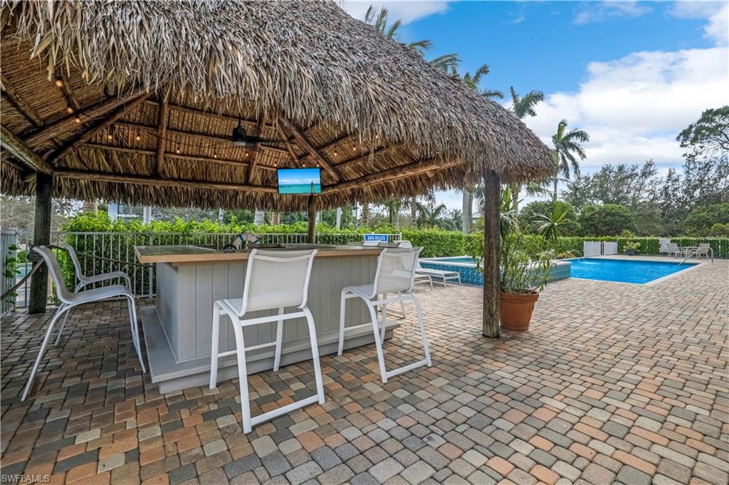 a patio with a yard table and chairs