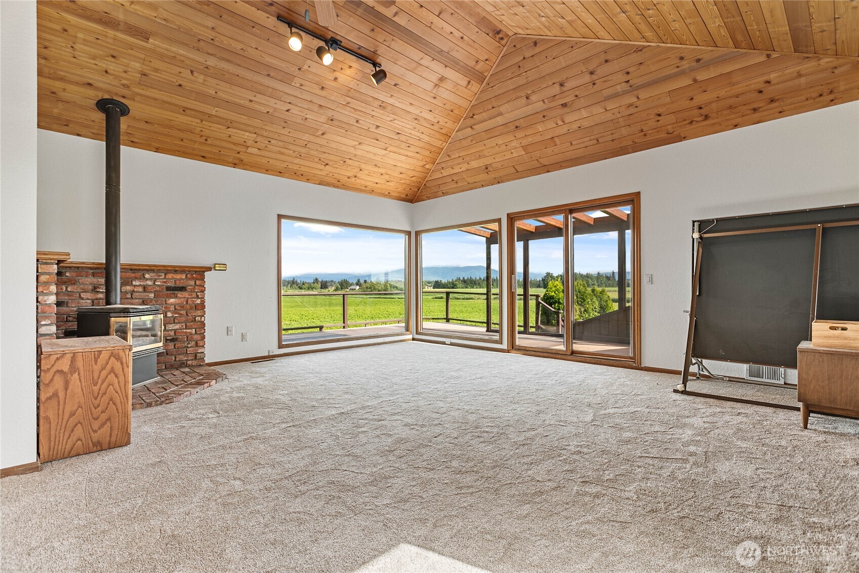 1133 East Pole Road Everson, WA 98247 - Photo 28 of 40 a view of an empty room with a fireplace and a window