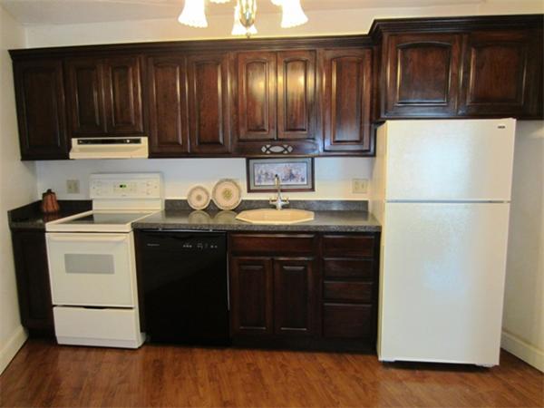 147 Turner Road, Unit 95 Holliston, MA 01746 - Photo 3 of 10 a kitchen with a refrigerator and a stove