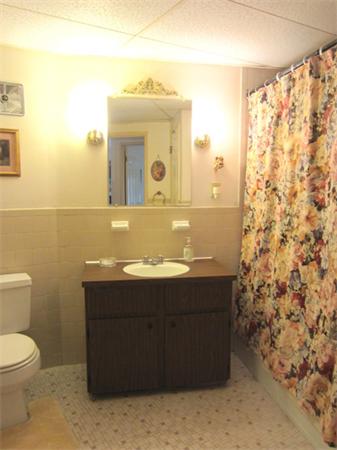 147 Turner Road, Unit 95 Holliston, MA 01746 - Photo 8 of 10 a bathroom with a sink and a mirror