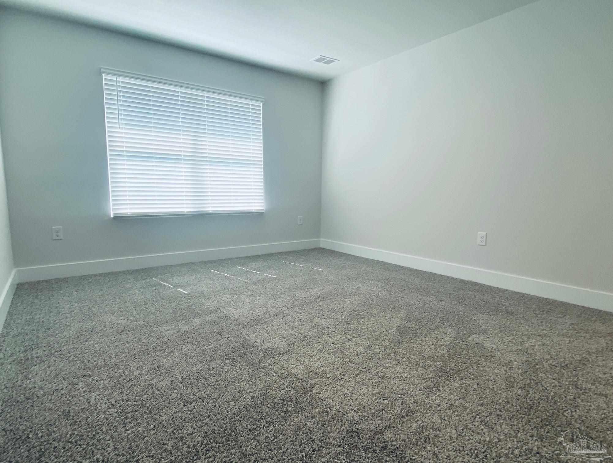 3021 Serviceberry Road Cantonment, FL 32533 - Photo 9 of 21 an empty room with a window