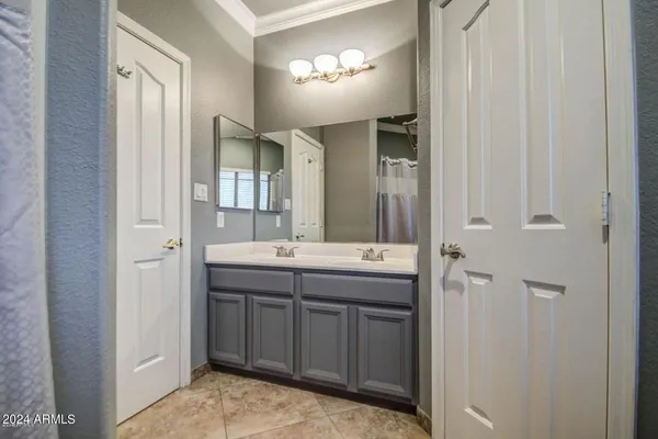 a bathroom with a double vanity sink and mirror