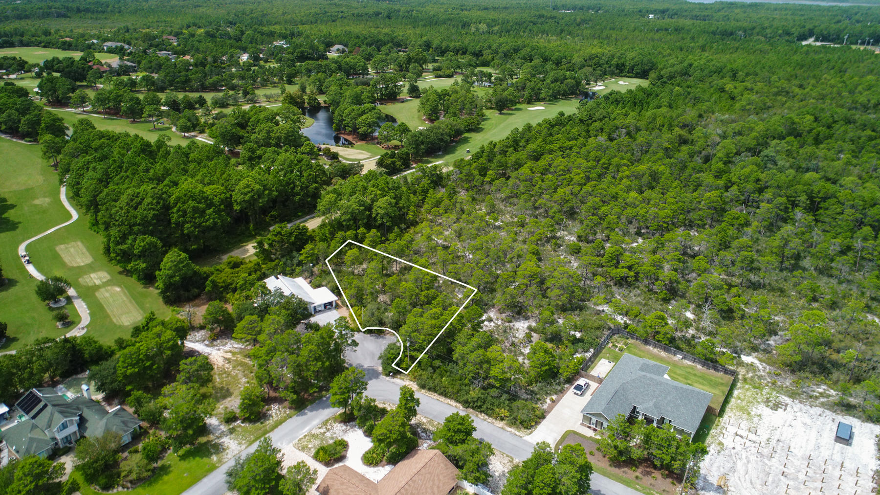 Lot 11 Lot Road Santa Rosa Beach, FL 32459 - Photo 9 of 15 an aerial view of a house with a lush green forest