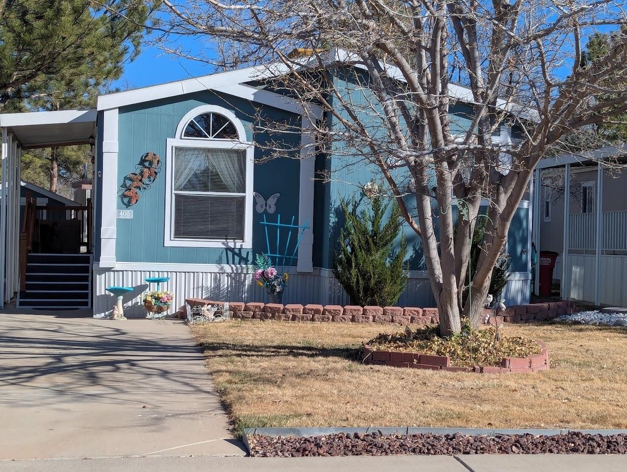 435 32 Road, Unit 405 Clifton, CO 81520 - Photo 1 of 26 a view of a house with a yard