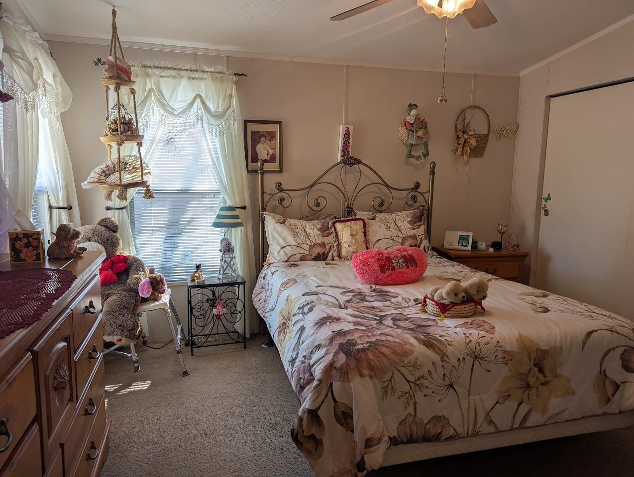 435 32 Road, Unit 405 Clifton, CO 81520 - Photo 13 of 26 a bedroom with a bed and a chandelier