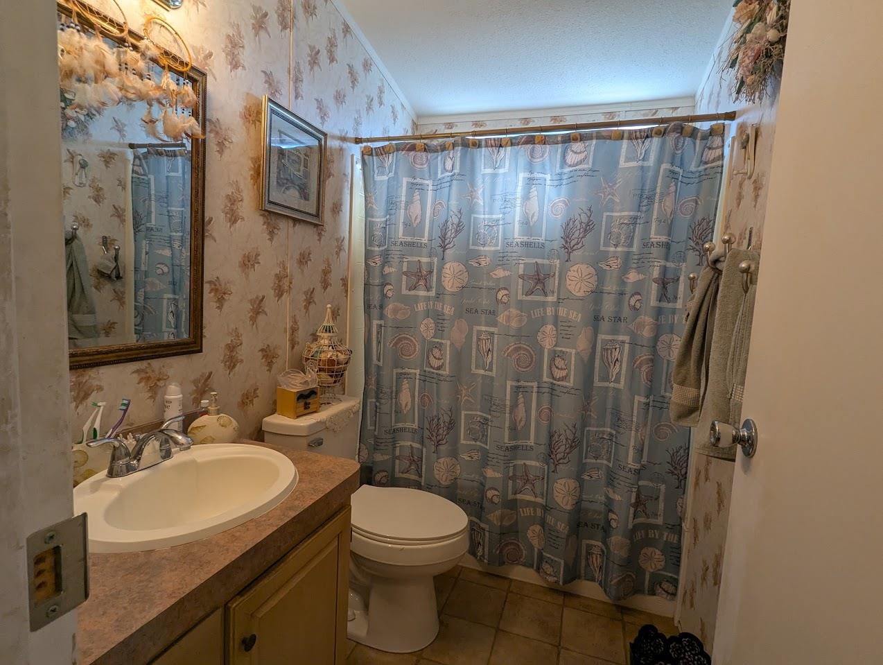 435 32 Road, Unit 405 Clifton, CO 81520 - Photo 17 of 26 a bathroom with a sink toilet and shower