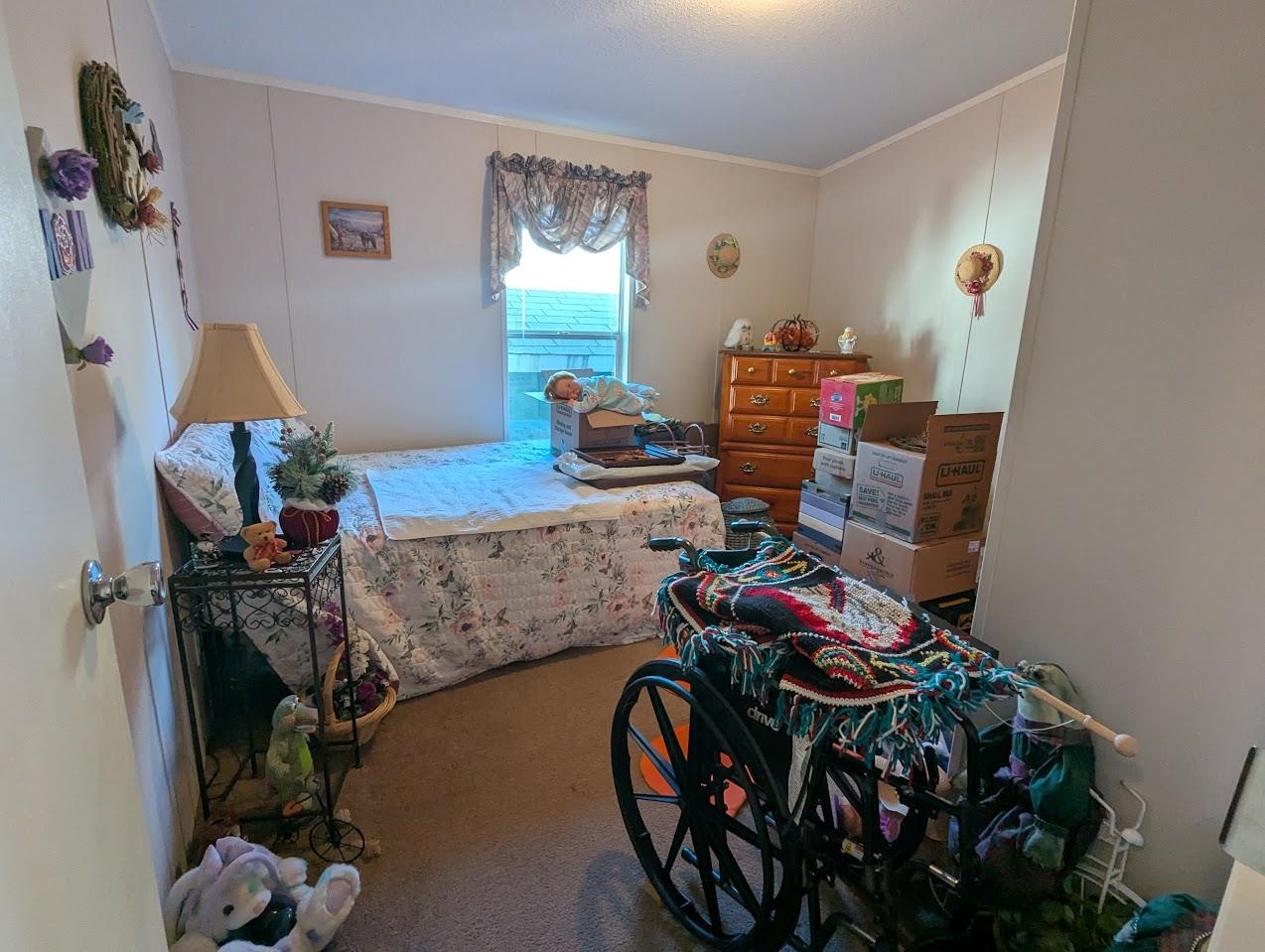 435 32 Road, Unit 405 Clifton, CO 81520 - Photo 18 of 26 a bedroom with furniture and a wooden floor