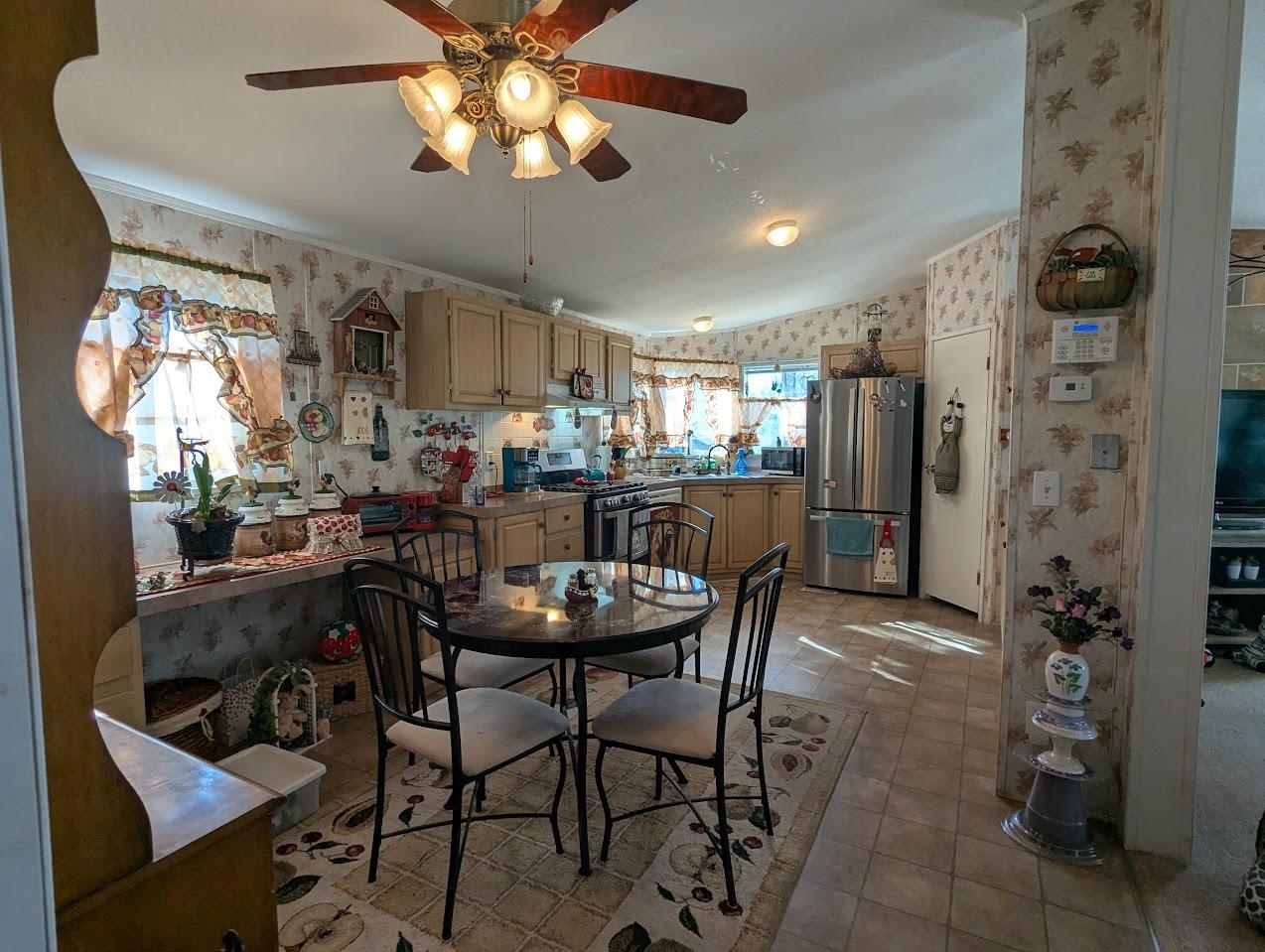 435 32 Road, Unit 405 Clifton, CO 81520 - Photo 2 of 26 a view of a dining room with furniture and a chandelier fan