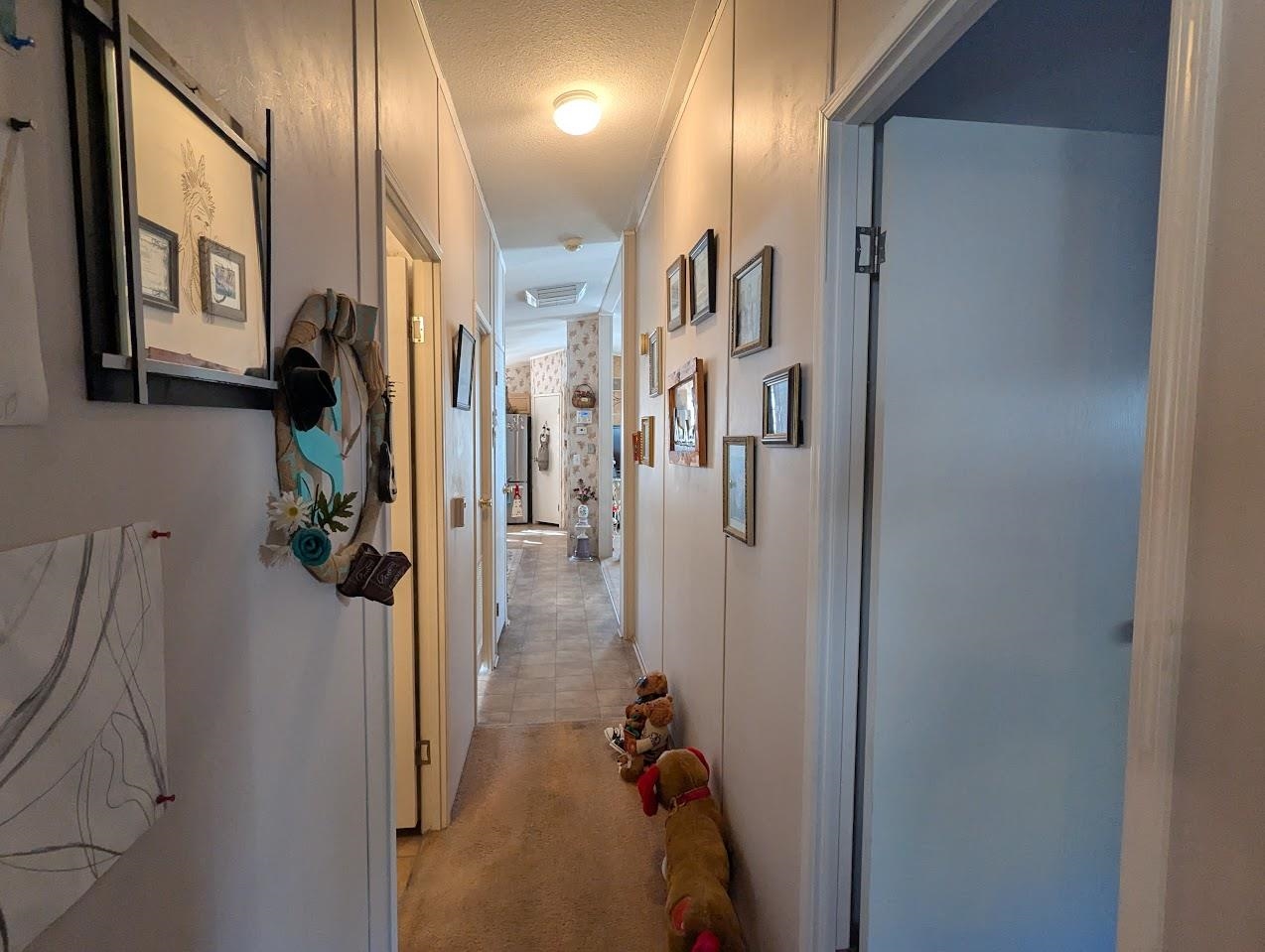 435 32 Road, Unit 405 Clifton, CO 81520 - Photo 21 of 26 a view of a hallway with walk in closet