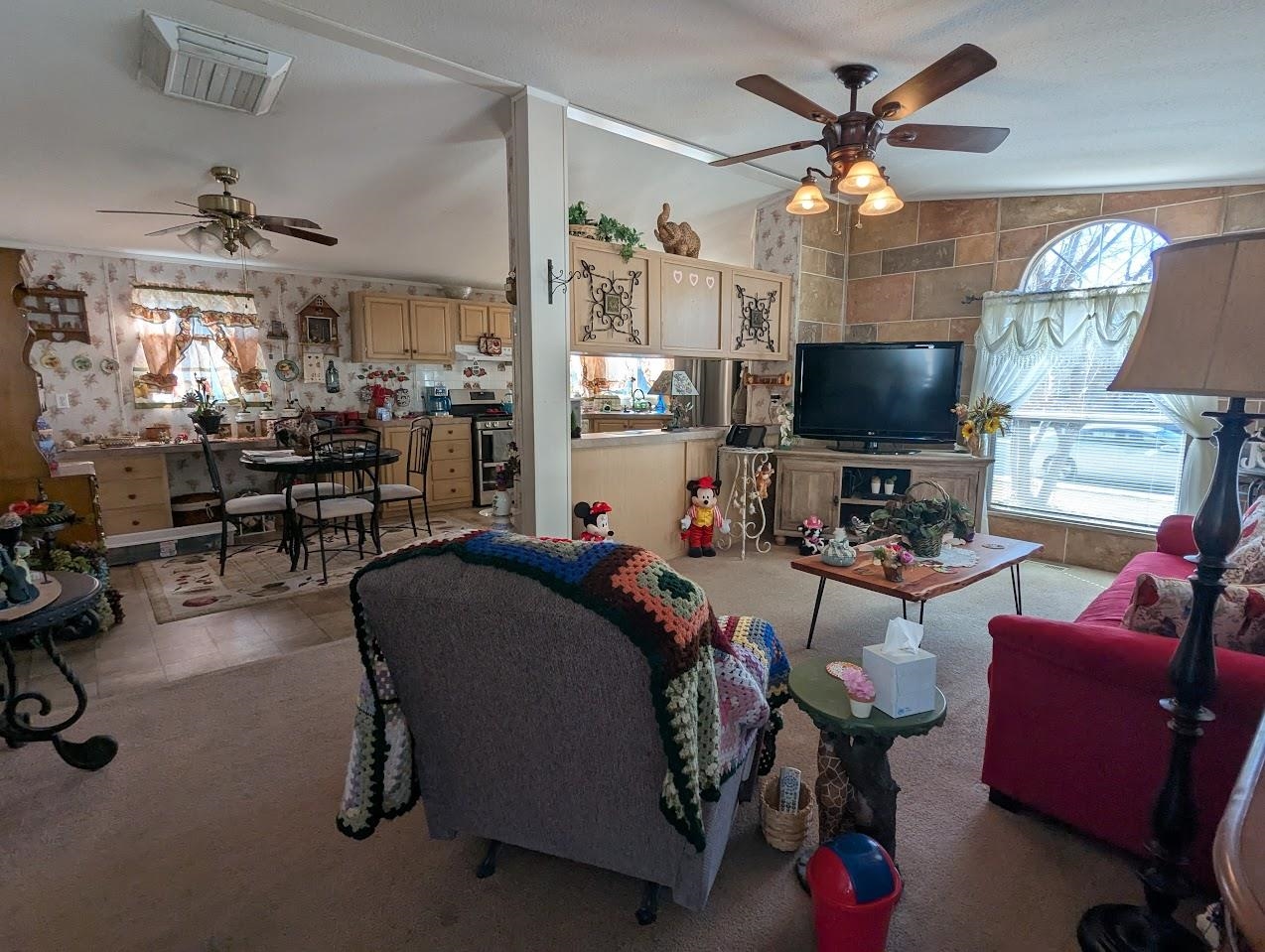 435 32 Road, Unit 405 Clifton, CO 81520 - Photo 6 of 26 a living room with furniture and a flat screen tv