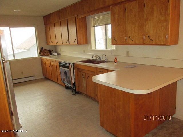 110 Charvet Road Grandview, WA 98930 - Photo 2 of 9 a kitchen with a sink cabinets and window