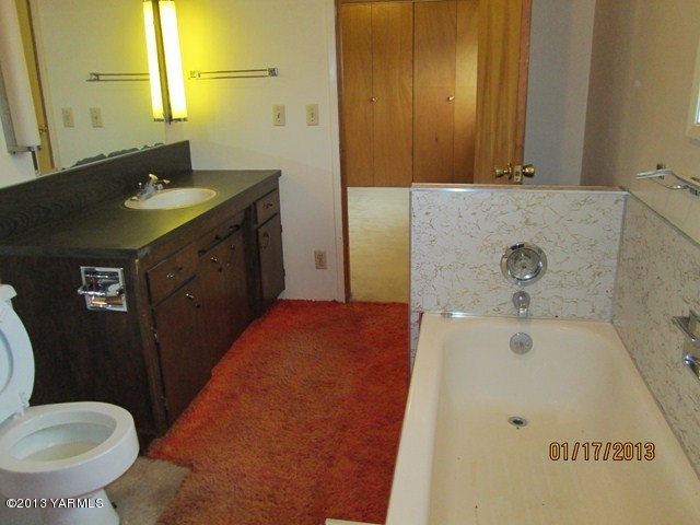 110 Charvet Road Grandview, WA 98930 - Photo 8 of 9 a bathroom with a sink and toilet