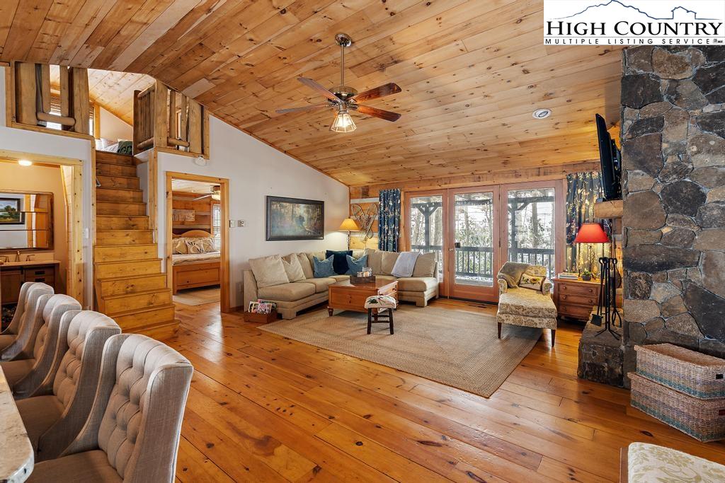 3855 Howard's Creek Road Boone, NC 28607 - Photo 11 of 38 a living room with furniture and a fireplace