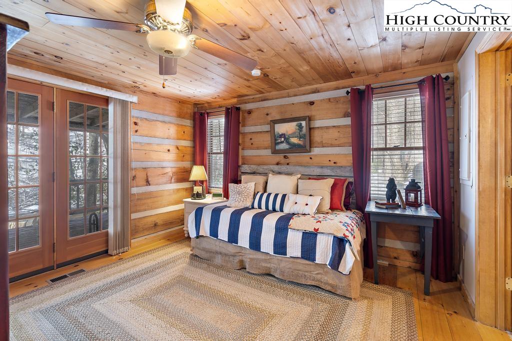 3855 Howard's Creek Road Boone, NC 28607 - Photo 25 of 38 a view of a porch with furniture and window