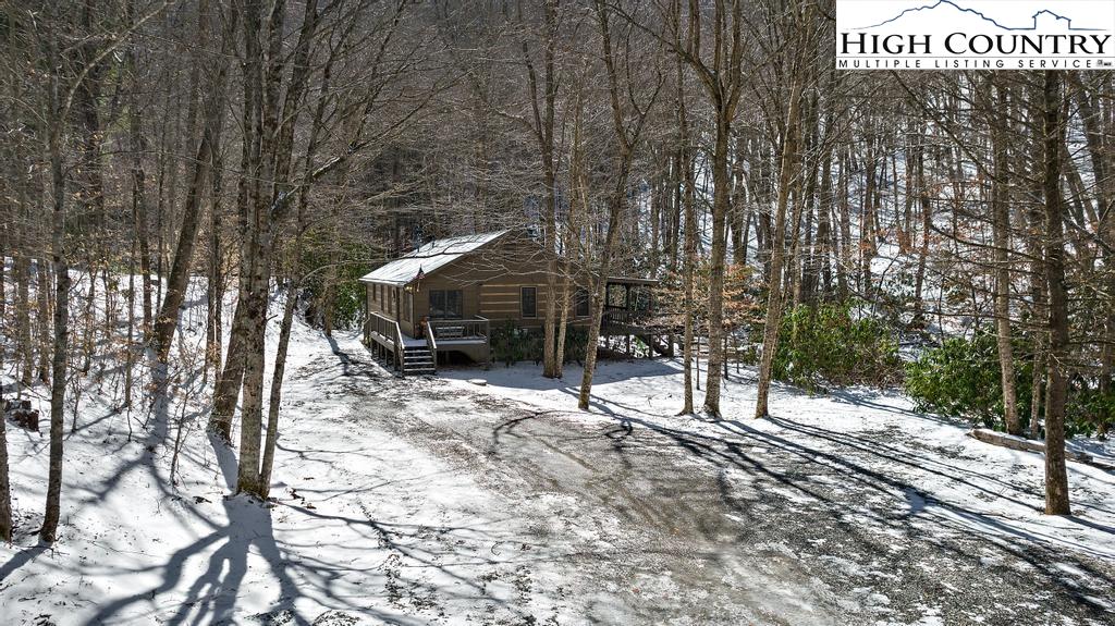 3855 Howard's Creek Road Boone, NC 28607 - Photo 3 of 38 a view of a house with backyard and sitting area