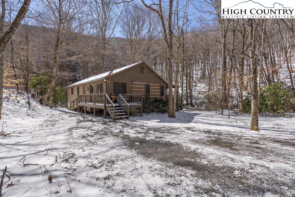 3855 Howard's Creek Road Boone, NC 28607 - Photo 4 of 38 a house with trees in the background